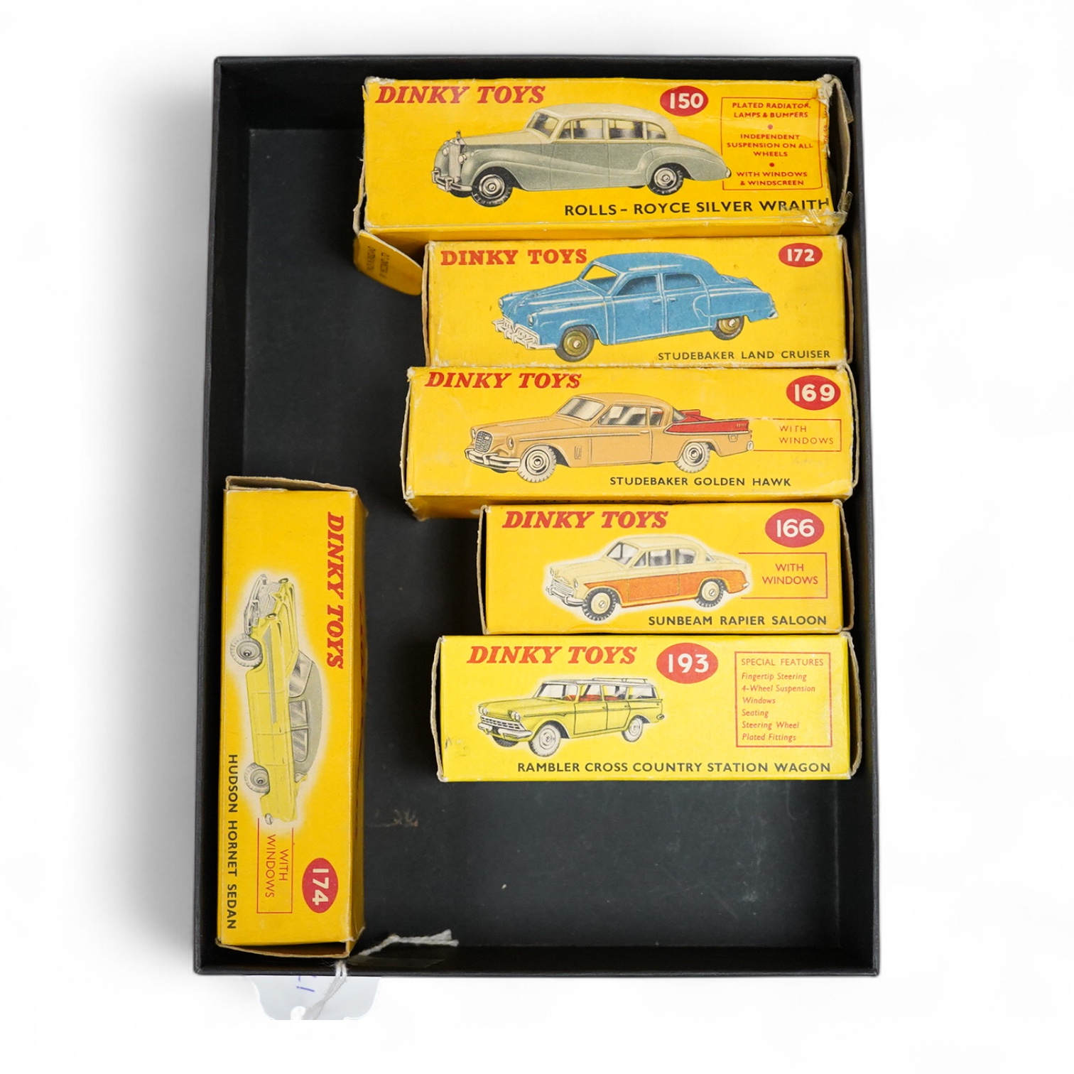 Six boxed Dinky Toys; Rolls-Royce Silver Wraith (150), Sunbeam Rapier Saloon (166), Studebaker Golden Hawk (169), Studebaker Land Cruiser (172), Hudson Hornet Sedan (174), and Rambler Cross Country Station Wagon (193)